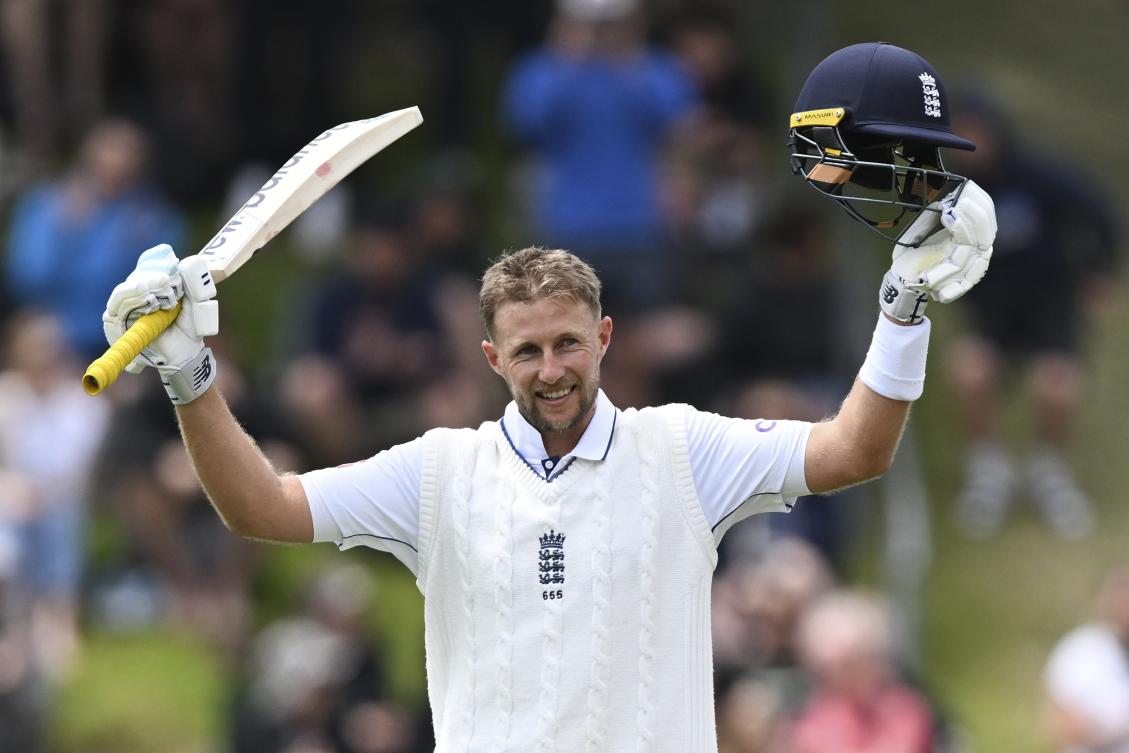 England's Joe Root reacts after scoring a century during play on day three of the second cricket test between New Zealand and England at the Basin Reserve in Wellington, New Zealand, Sunday, Dec.8, 2024. (Andrew Cornaga/Photosport via AP)