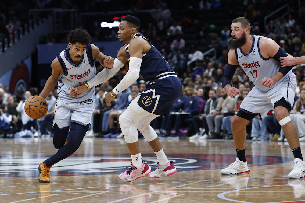 Washington Wizards guard Jordan Poole drives to the basket as Denver Nuggets guard Russell Westbrook defends in the fourth quarter of an NBA game at Capital One Arena Saturday. (USA TODAY Sports)