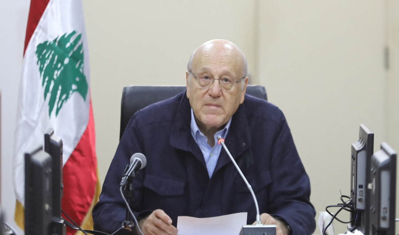 This handout picture provided by the Lebanese Prime Minister's press office shows Lebanon's caretaker Prime Minister Najib Mikati chairing a ministerial meeting in the Benoit Barakat barracks in the southern Lebanese city of Tyre on December 7, 2024. (AFP/File)