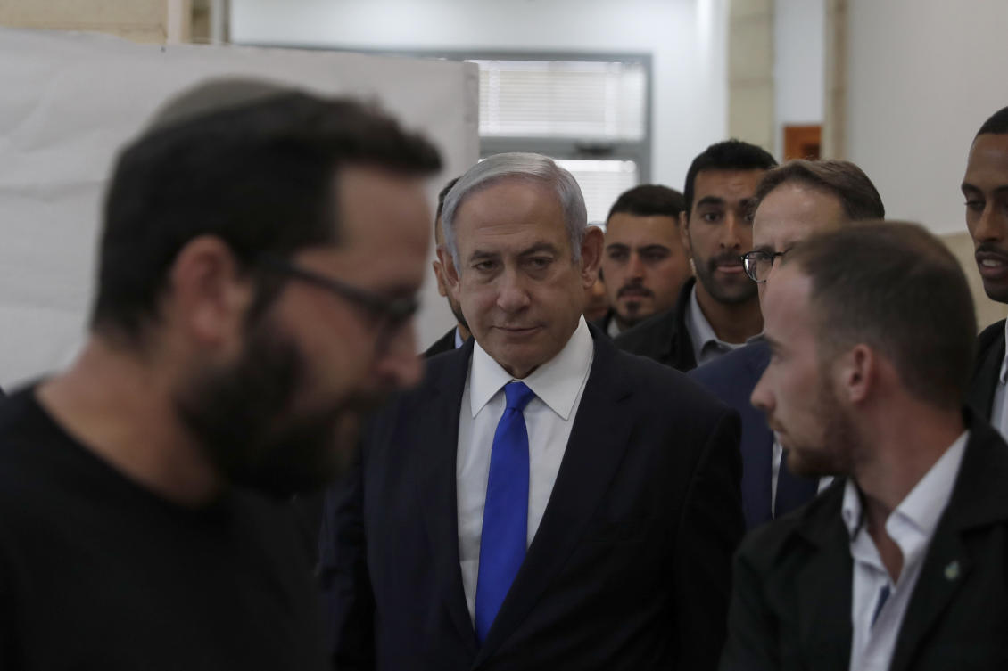 File photo of Israeli Prime Minister Benjamin Netanyahu, center, arrives at the District Court in Jerusalem, Israel, June 25, 2023. (AP)