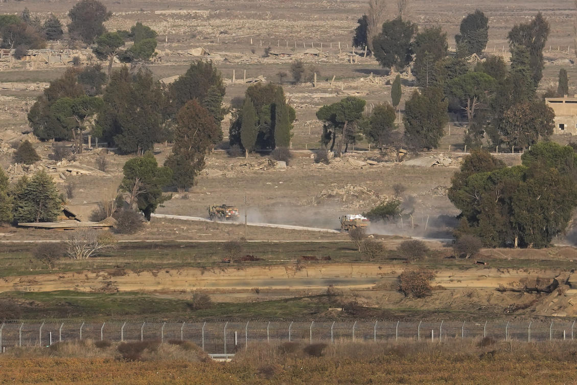 Israeli armored vehicles maneuver on the Syrian side of the Quneitra crossing, between Israel and Syria, are viewed from the Israeli-annexed Golan Heights, Monday, Dec. 9, 2024. (AP)