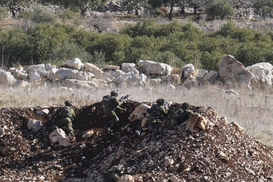 Israeli soldiers take position near the so-called Alpha Line that separates the Israeli-annexed Golan Heights from Syria, in the town of Majdal Shams, Monday, Dec. 9, 2024. (AP)