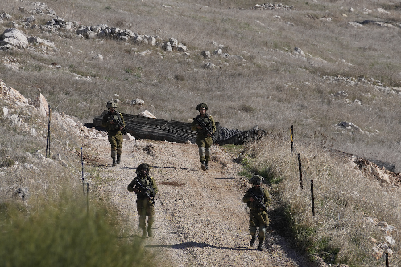 Israeli soldiers patrol near the so-called Alpha Line that separates the Israeli-annexed Golan Heights from Syria, in the town of Majdal Shams, Monday, Dec. 9, 2024. (AP)