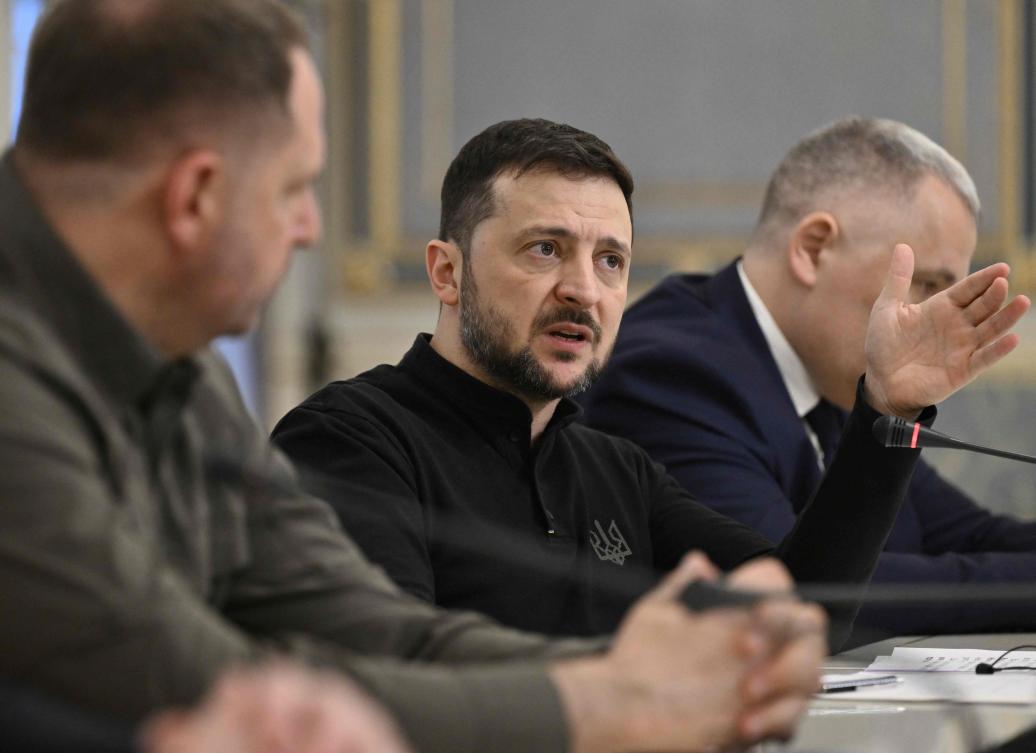 Ukrainian President Volodymyr Zelensky speaks with Leader of Germany’s Christian Democratic Union (CDU) during their meeting in Kyiv on December 9, 2024, amid the Russian invasion of Ukraine. (AFP)