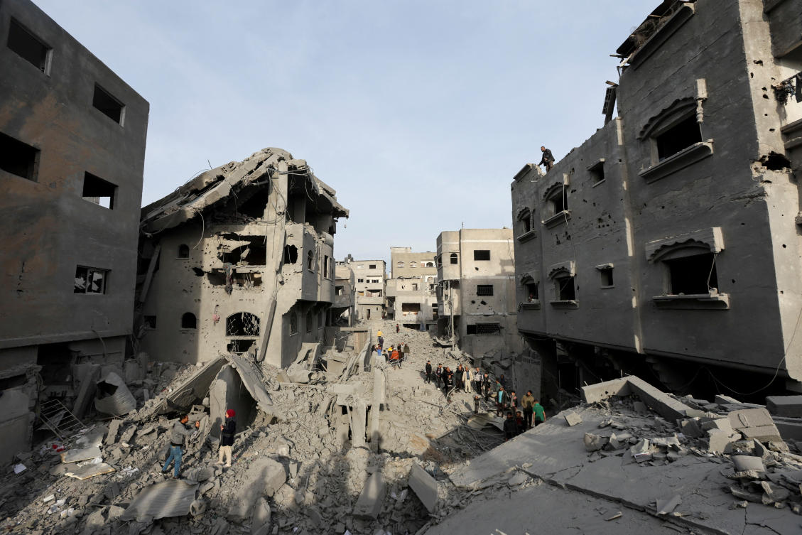 FILE PICTURE Palestinians inspect damage at the site of an Israeli strike on a house, amid the Israel-Hamas conflict, at the Nuseirat refugee camp in the central Gaza Strip, December 7, 2024. (Reuters)