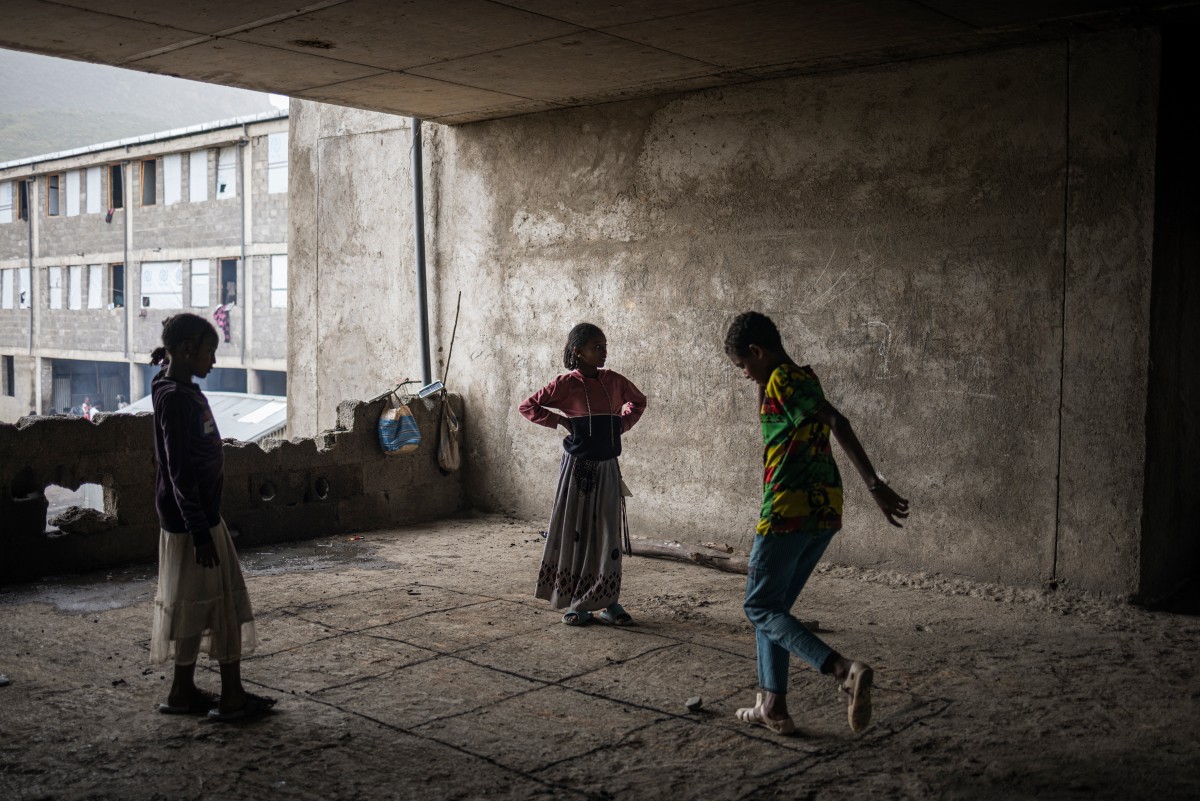 Children play inside the unfinished structure of a school ground used as shelter at the NSPS internally displaced persons (IDPs) camp in Adwa, Tigray region, on July 17, 2024. (File/AFP)