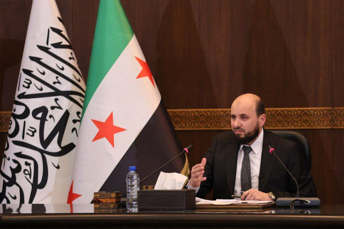 Syria's new transitional prime minister Mohammad Al-Bashir chairing a meeting of the new cabinet in Damascus on Dec. 10. (AFP)