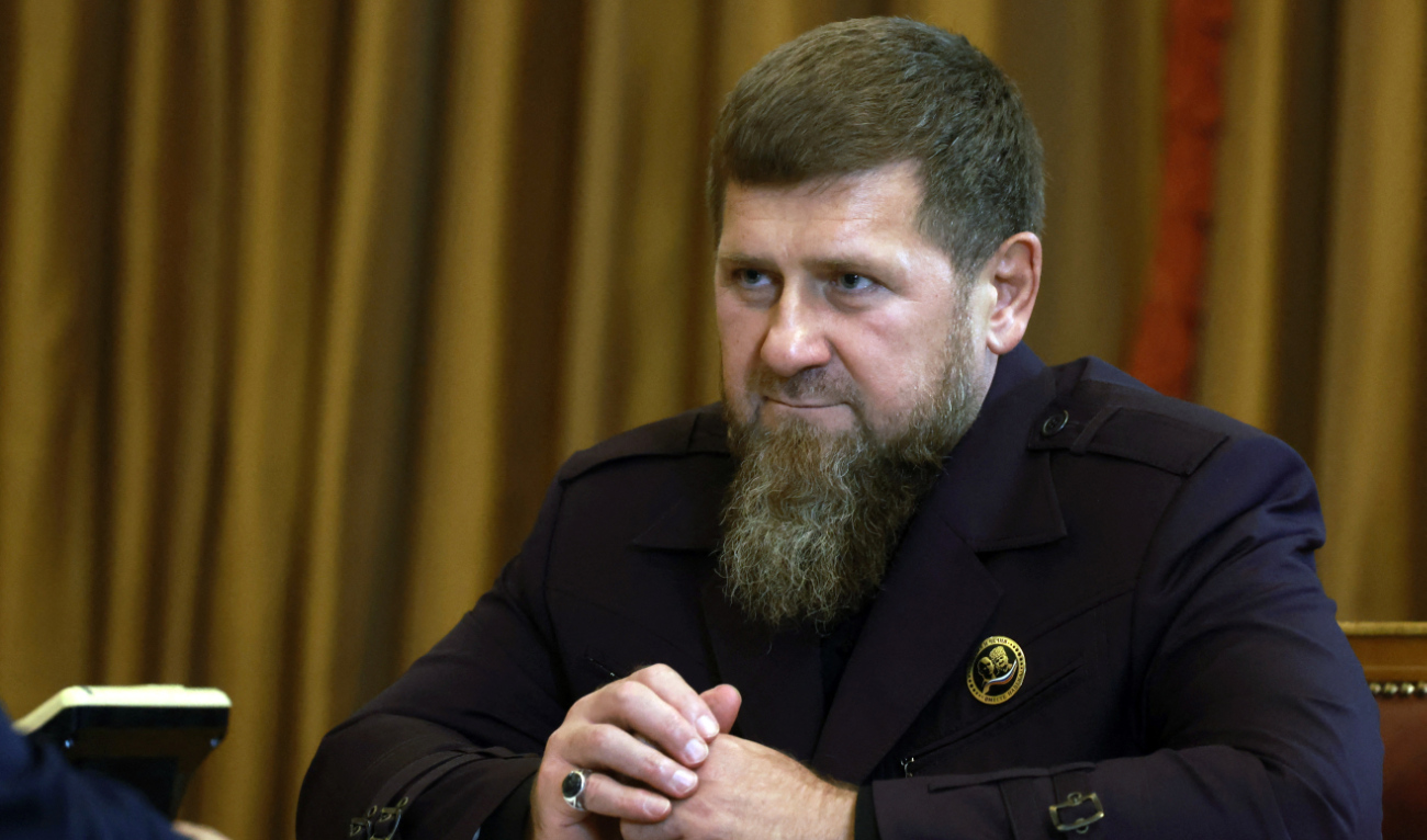 In this pool photograph distributed by Russian state owned Sputnik agency the head of the Chechen Republic Ramzan Kadyrov looks on during a meeting with Russia's President Vladimir Putin in Grozny, on August 20, 2024. (AFP/File)