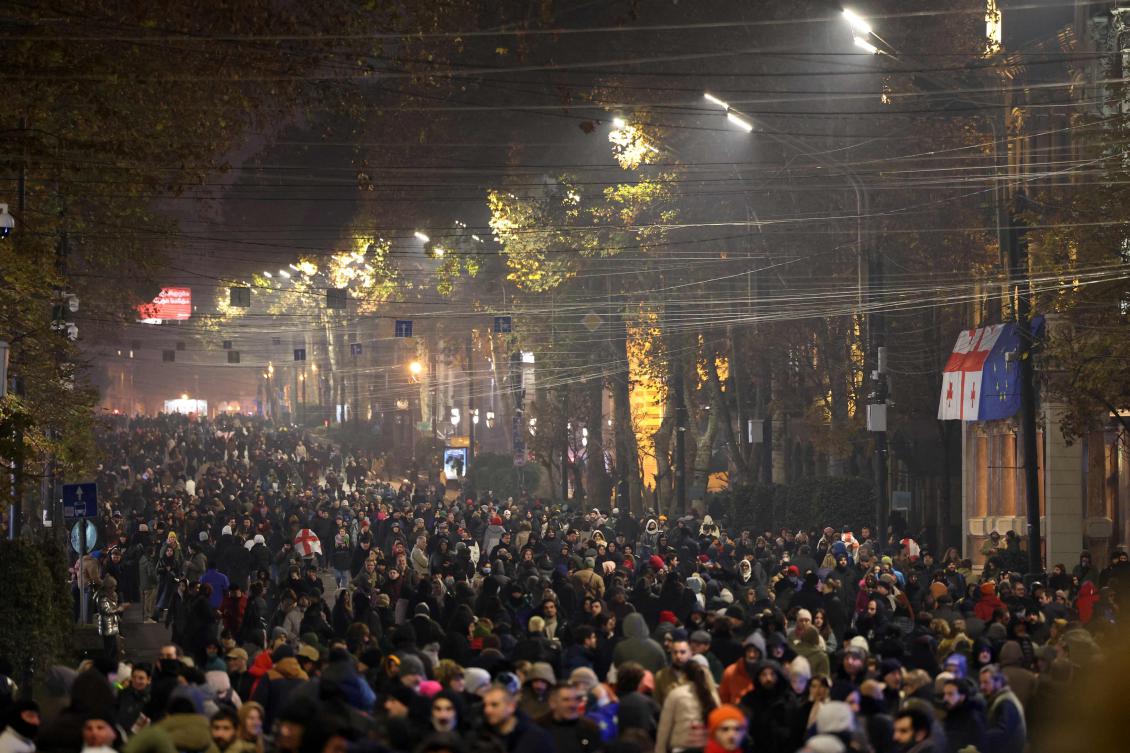 Anti-government demonstrators protest against the Government’s postponement of European Union accession talks until 2028, outside the Parliament in central Tbilisi on Dec. 10, 2024. (AFP)
