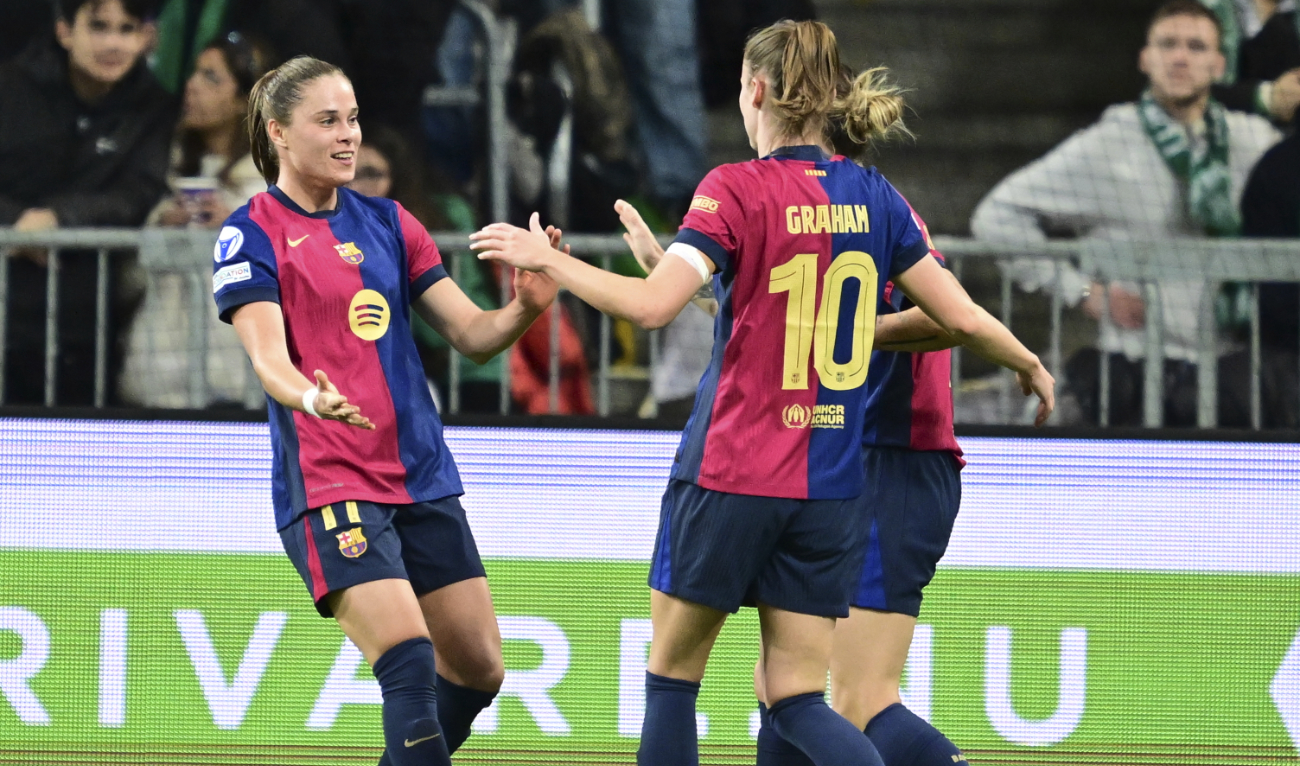 Barcelona's Ewa Pajor, left, celebrates scoring during the Champions League group D women's soccer match between Hammarby IF and FC Barcelona at Stockholm Arena in Stockholm, Sweden, Thursday Dec. 12, 2024. (AP)