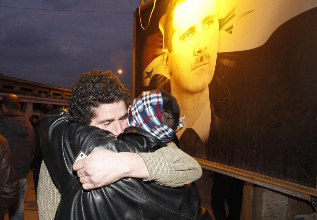 Above, a Syrian prisoner, left, hugs his brother after being released from Adra Prison on the northeast outskirts of Damascus on Jan. 16, 2012. (AP)