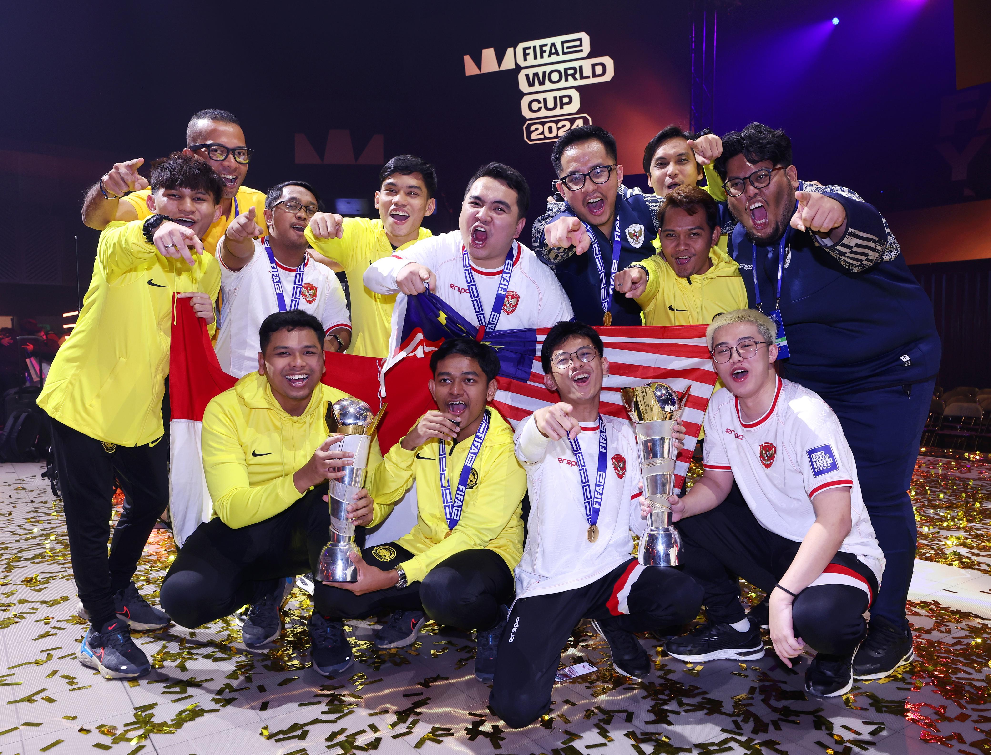 Malaysia (Yellow) and Indonesia (White) celebrate their FIFAe World Cup featuring eFootball wins in Riyadh. (Supplied)