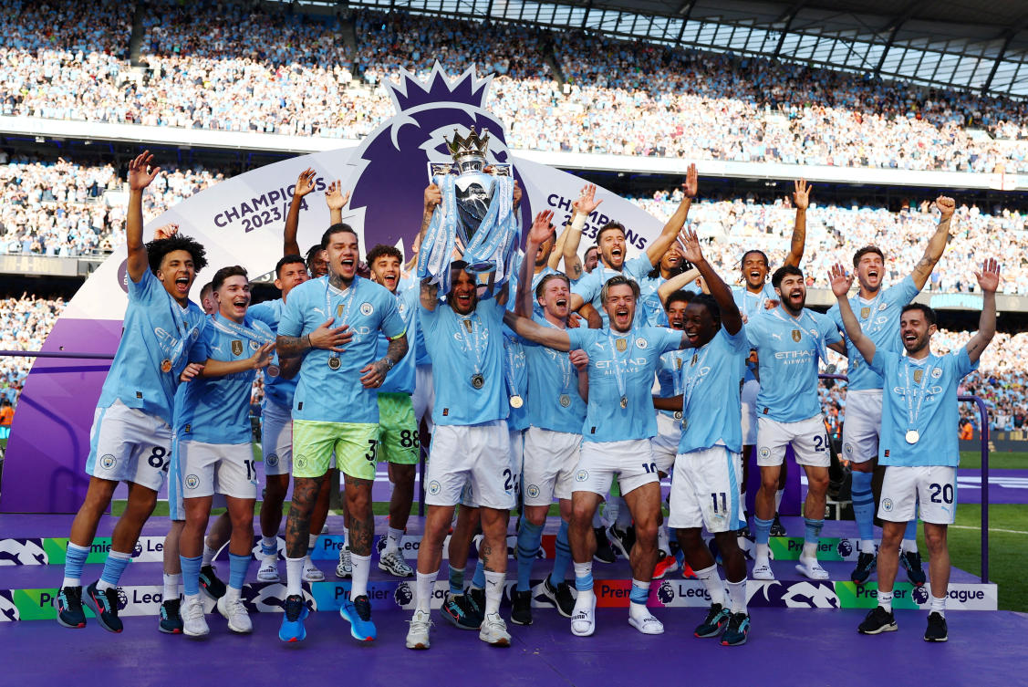 Manchester City celebrate with the trophy after winning the Premier League on Mau 19, 2024. (Reuters)