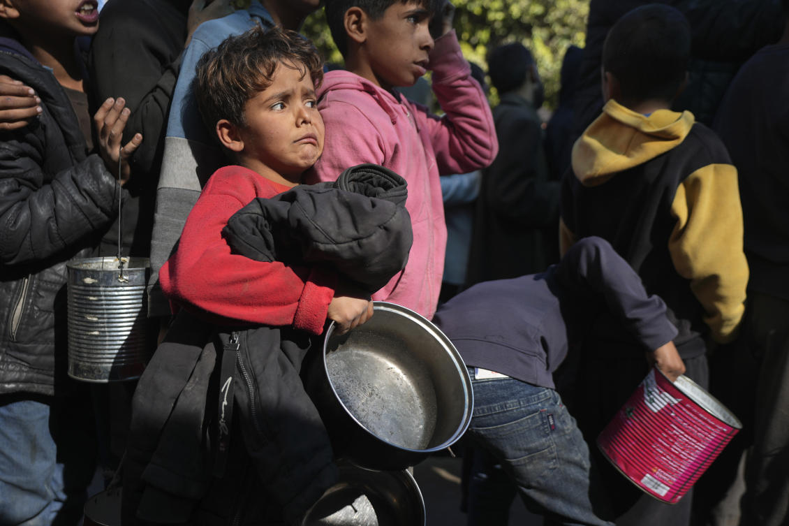 Palestinian children queue for food in Deir al-Balah, Gaza Strip, Friday, Dec. 13, 2024. (AP)