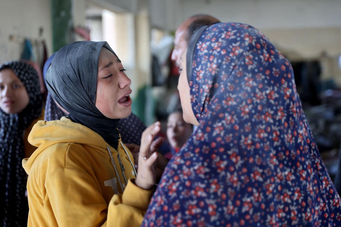 A woman mourns the death of a loved one following an Israeli strike on the UNWRA Al-Majda Wasila Governmental School housing displaced Palestinians, on Al-Jalaa Street in Gaza on Dec. 14, 2024. (AFP)