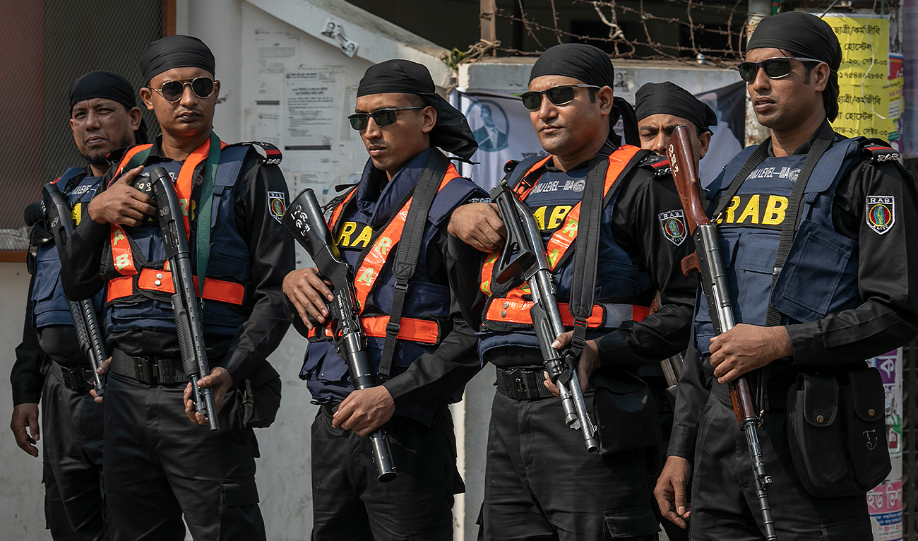 Bangladeshi Rapid Action Battalion personnel stand guard during Bangladesh’s 12th National Parliament Elections in Dhaka on January 7, 2024. (Reuters/File)