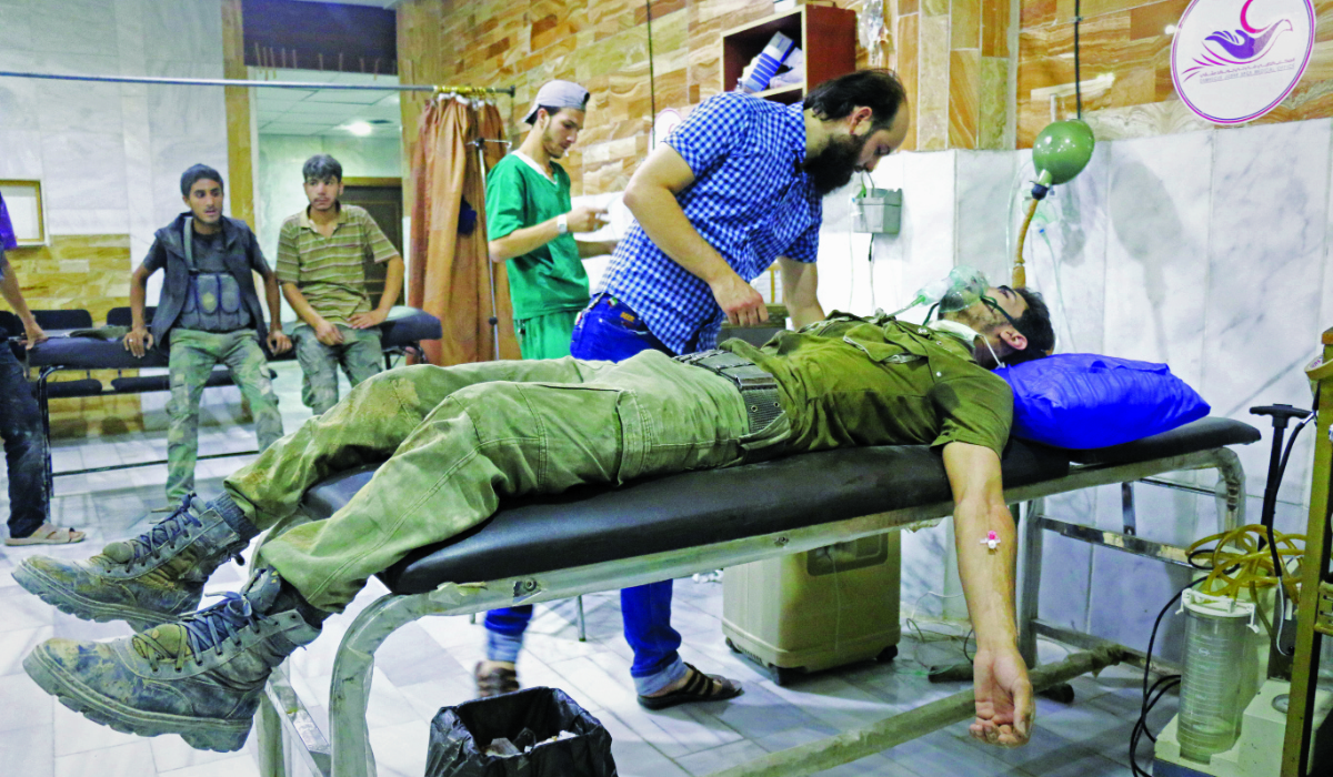 A member of opposition forces receives medical treatment after Assad regime's alleged chemical gas attack over oppositions' frontline, where is included in deconfliction zone in East Ghouta of Damascus, Syria on July 20, 2017. (Getty Images)