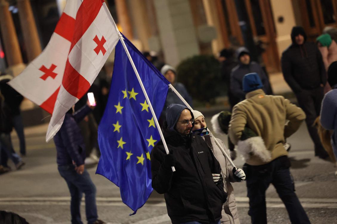 Anti-government demonstrators protest outside the Georgian parliament in Tbilisi after the parliament members elected a new president on Dec. 15, 2024. (AFP)