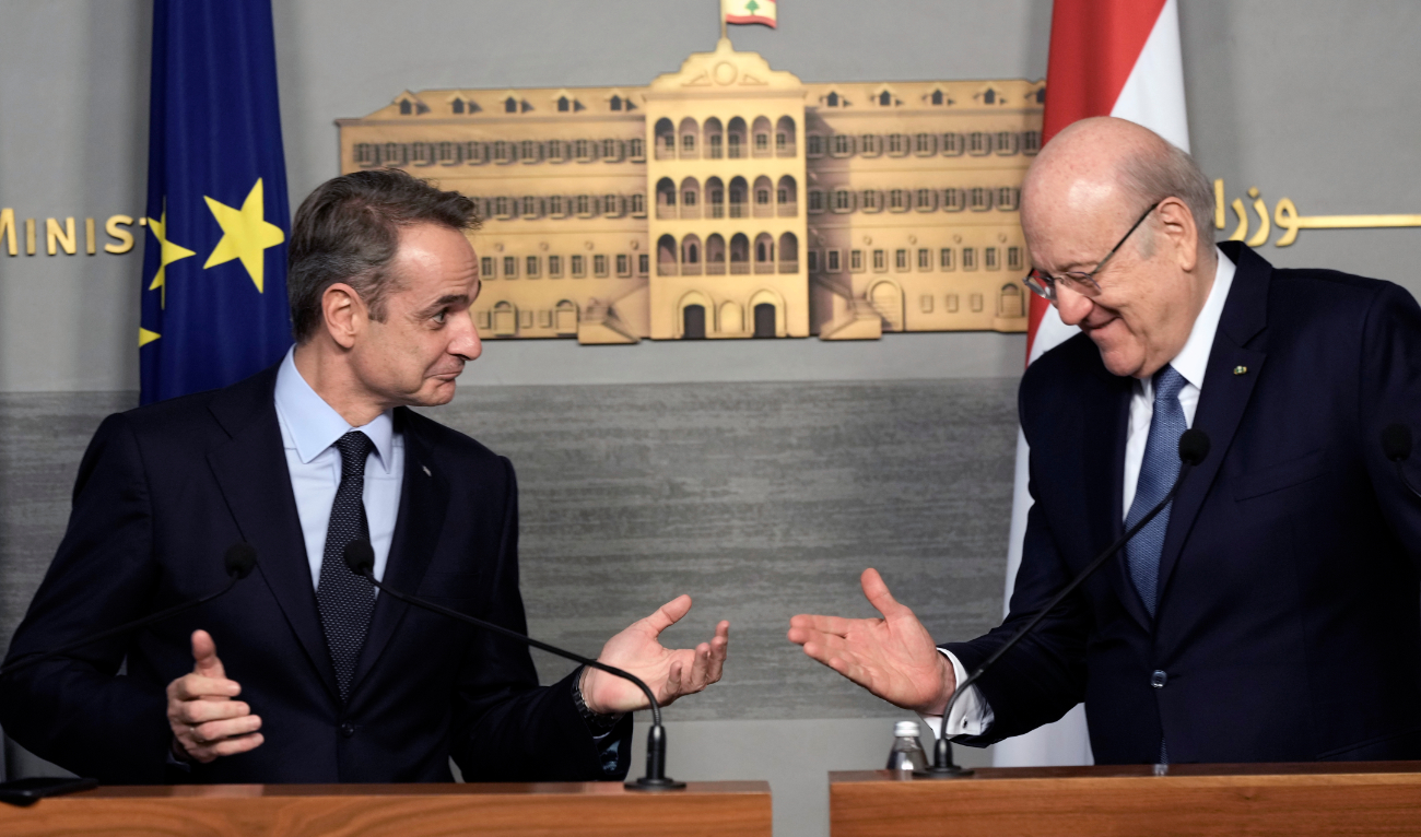 Greek Prime Minister Kyriakos Mitsotakis and Lebanese caretaker Prime Minister Najib Mikati address a joint press conference at the government palace in Beirut. (AP)