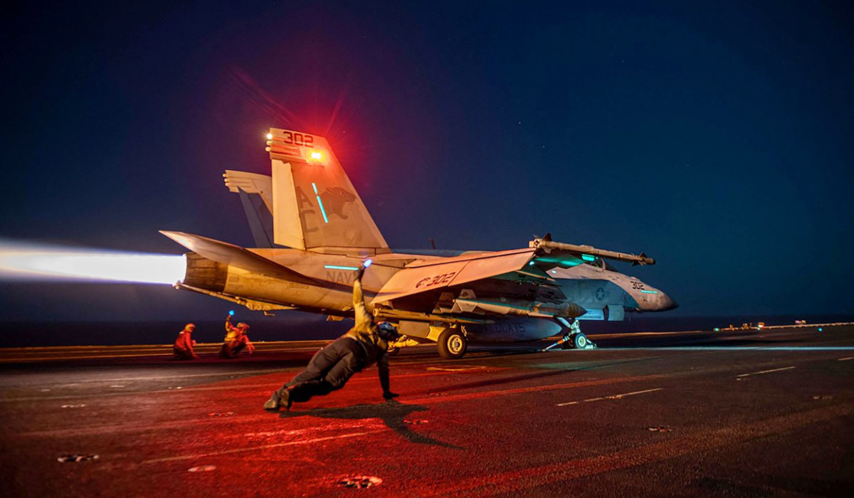 In this on February 24, 2024, image released by the US Central Command, a US fighter plane lauches from the deck of the aircraft carrier USS Eisenhower in the Red Sea during operations against Huthi targets. (AFP)
