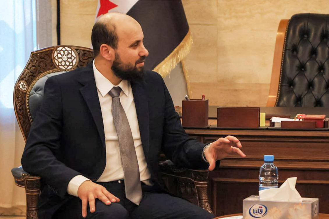 This handout image made available by the Telegram channel of the official Syrian Arab News Agency (SANA) early on December 17, 2024 shows Syria's interim prime minister Mohammad al-Bashir meeting with the UN Emergency Relief Coordinator in Damascus. (AFP)