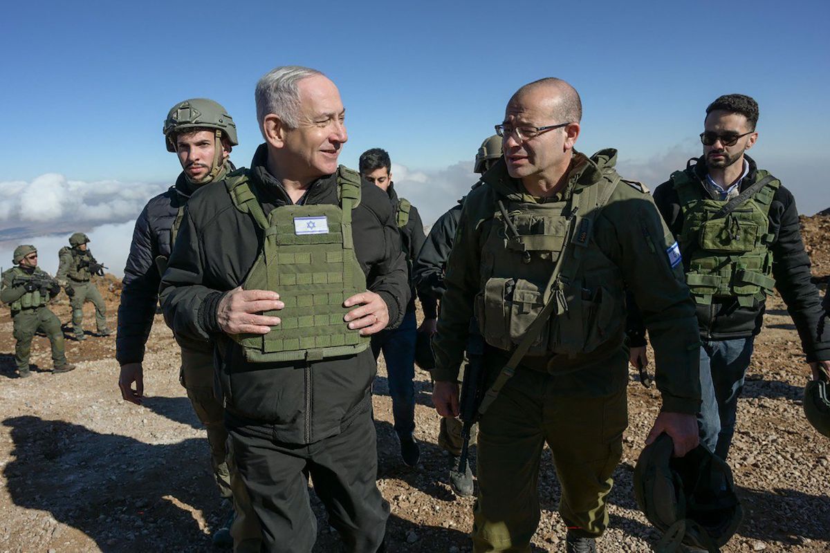 Israeli Prime Minister Benjamin Netanyahu visited Israeli forces at Mount Hermon 10km inside the buffer zone from the occupied Golan Heights. (GPO/AFP)