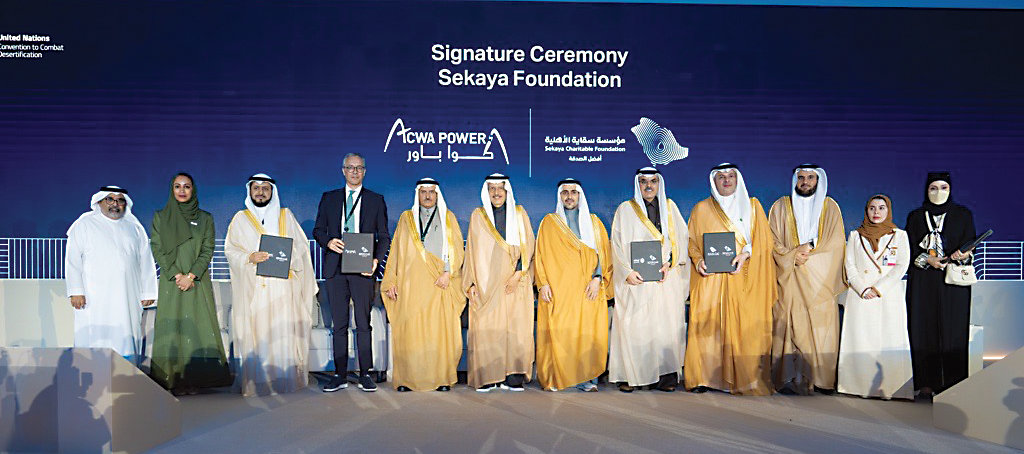 Officials attend the signing ceremony between ACWA Power and the Sekaya Foundation.