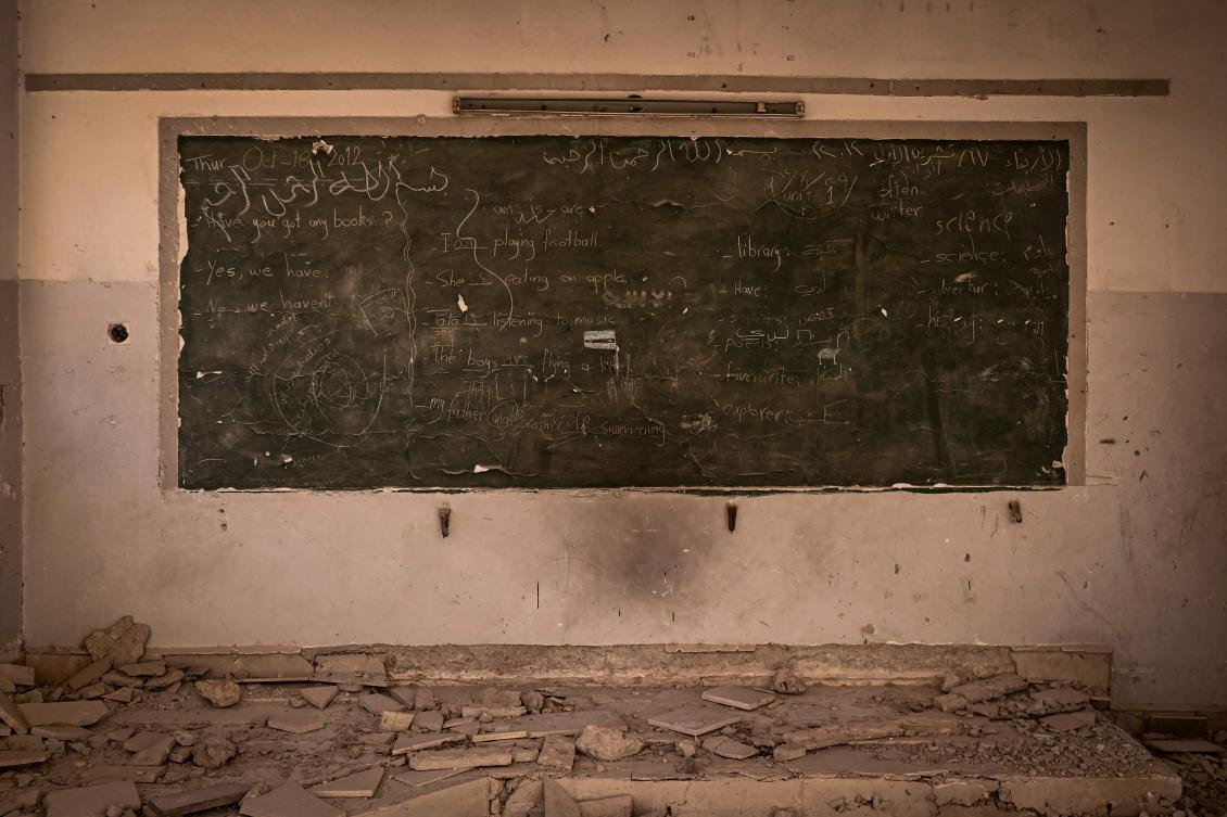 This picture shows a blackboard in a destroyed school at the Yarmuk camp for Palestinian refugees in the south of Damascus on December 19, 2024. (AFP)