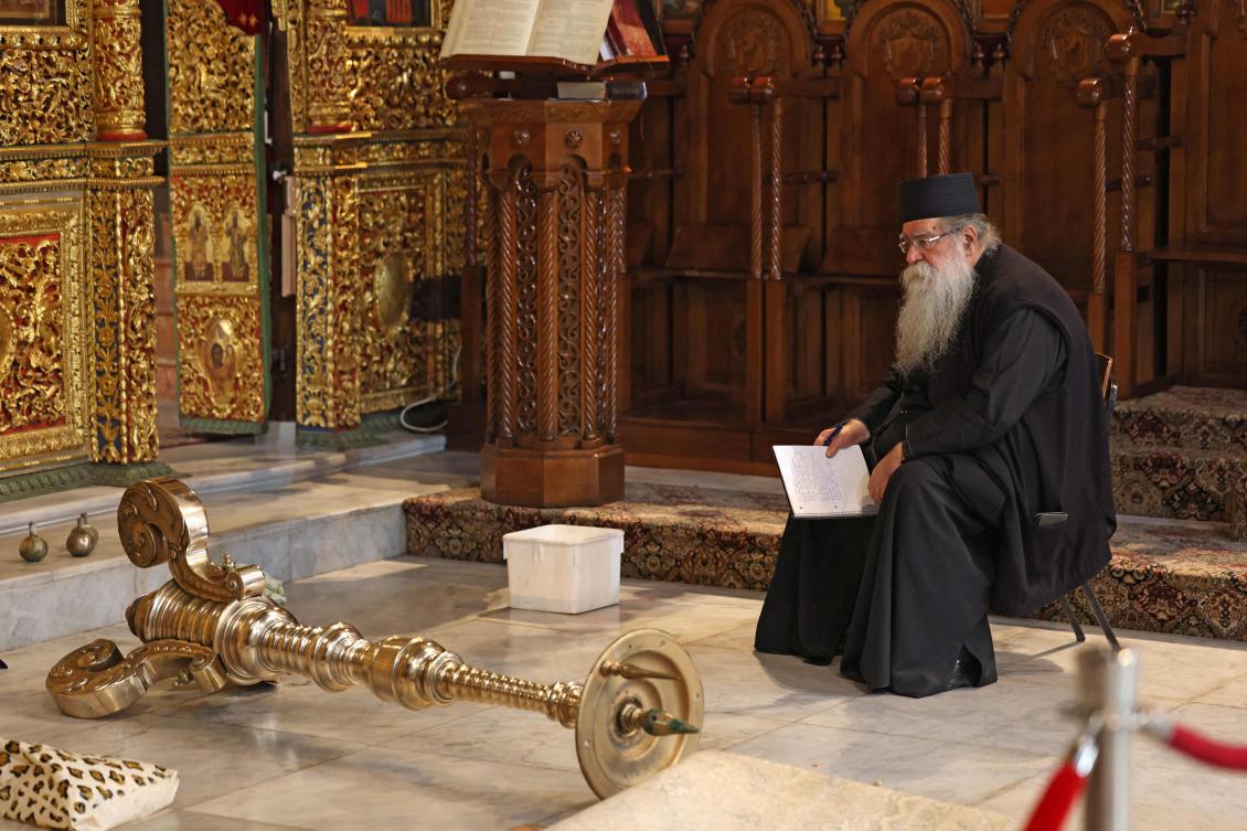 A man sits in the Church of the Nativity in the biblical city of Bethlehem, in the occupied West Bank, on December 17, 2024. (AFP)