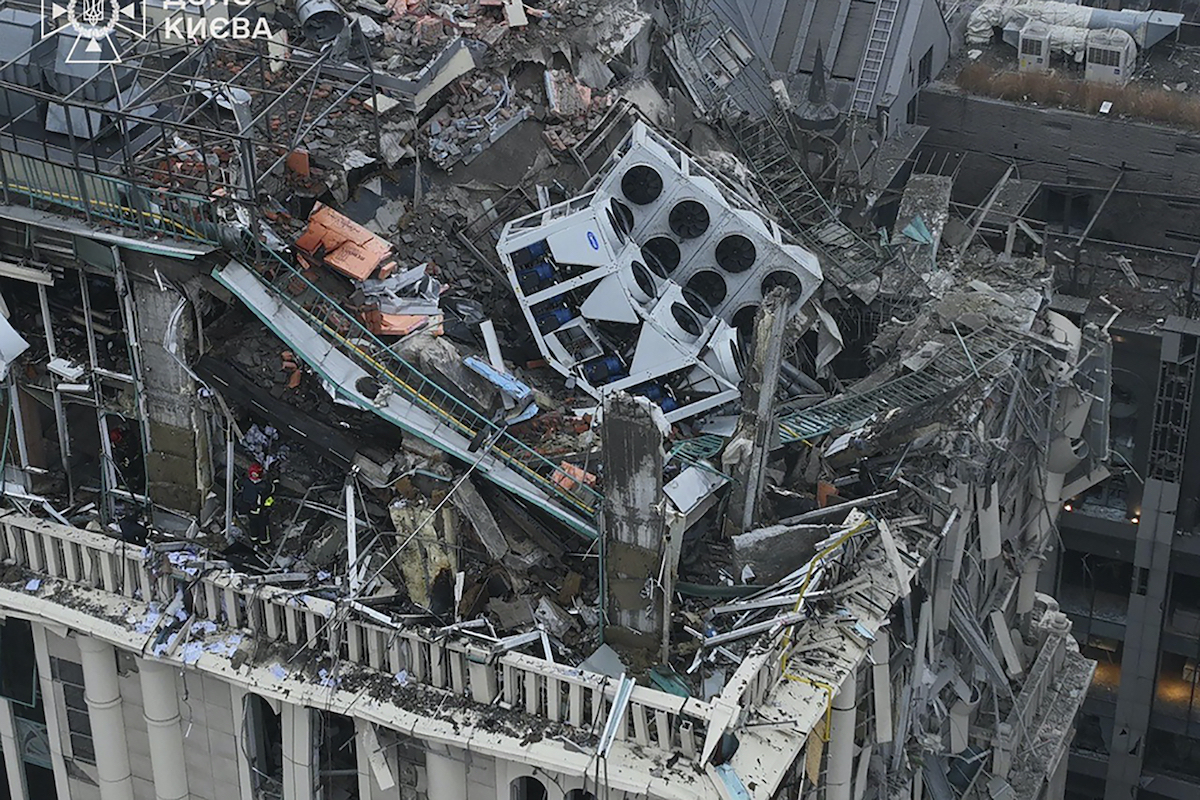 Firefighters work on the site of a damaged building after a Russian missile attack in Kyiv. (Ukrainian Emergency Service via AP)