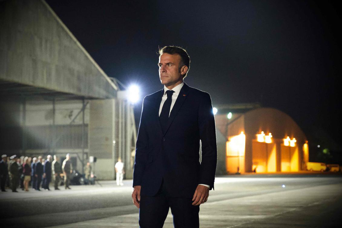 France's President Emmanuel Macron arrives to attend a Christmas dinner with French soldiers at an airbase in Djibouti. (AFP)
