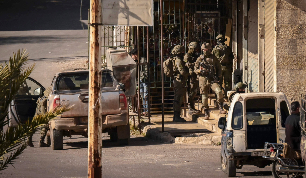 Israeli soldiers patrol in the Syrian town of Jubata al-Khashab, in the UN-patrolled buffer zone in the Israeli-annexed Golan Heights, on December 20, 2024. (AFP)