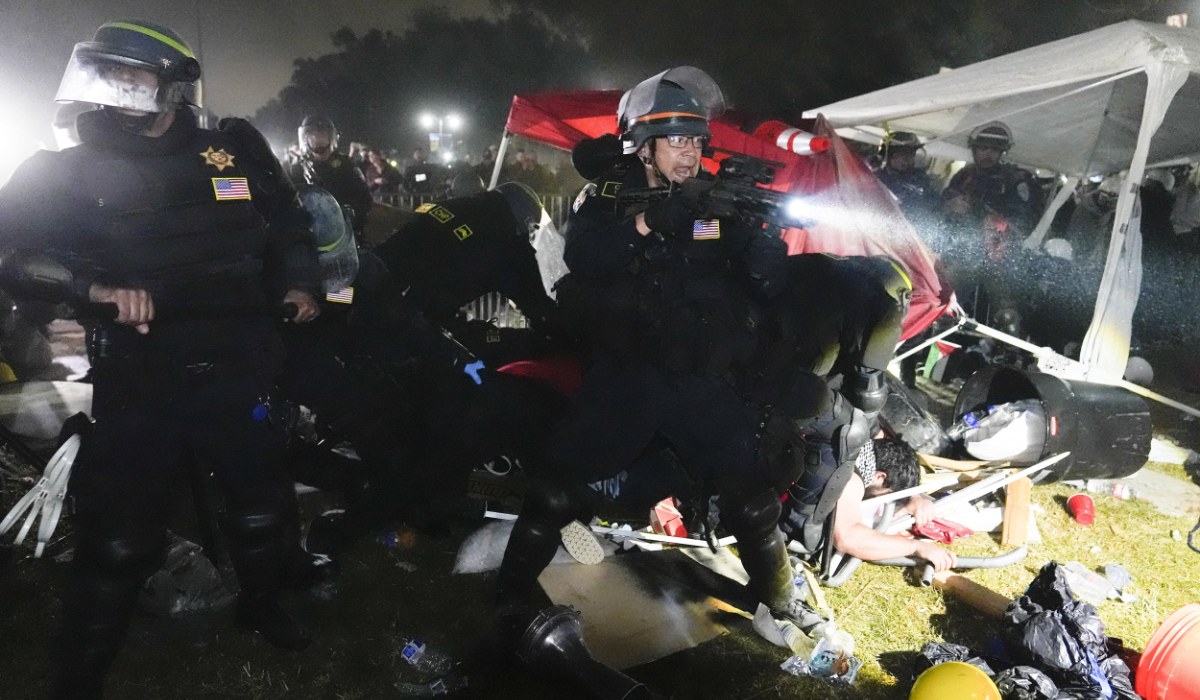 Police advance on pro-Palestinian demonstrators after defying orders to leave at an encampment on the UCLA campus, in Los Angeles, May 2, 2024. (AP)