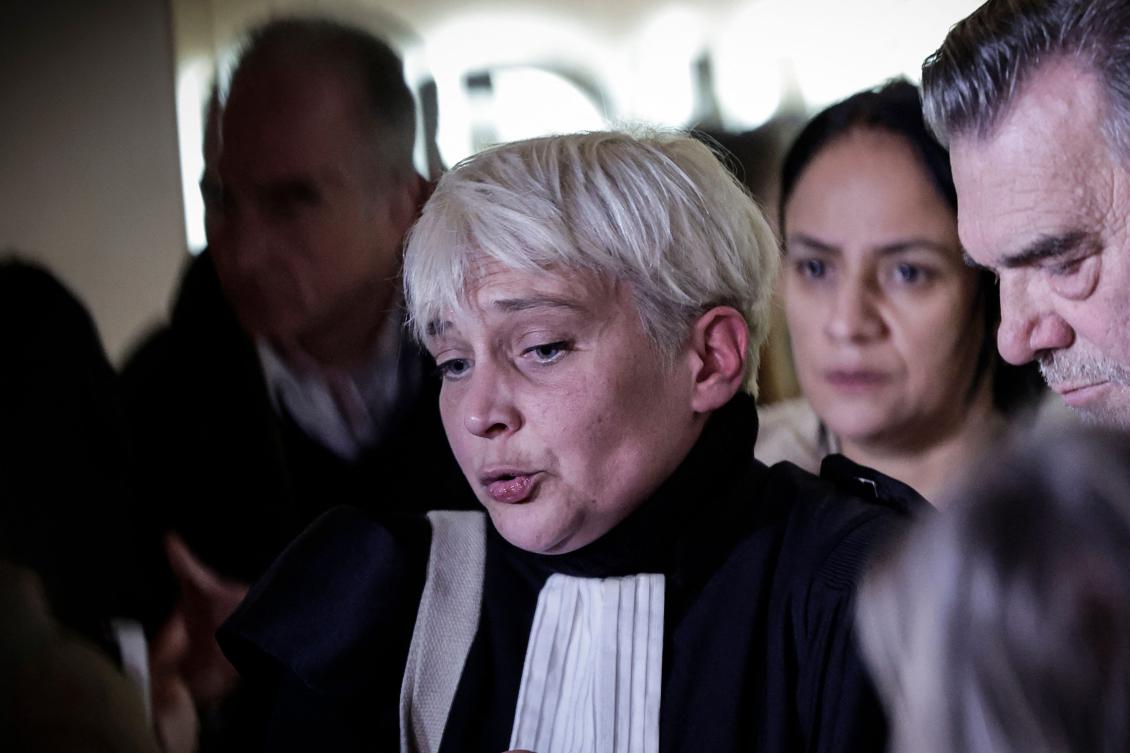 Louise Tort (C), French lawyer for defendant Brahim Chnina, speaks to the press at the Paris Special Assize Court after the verdict (AFP)