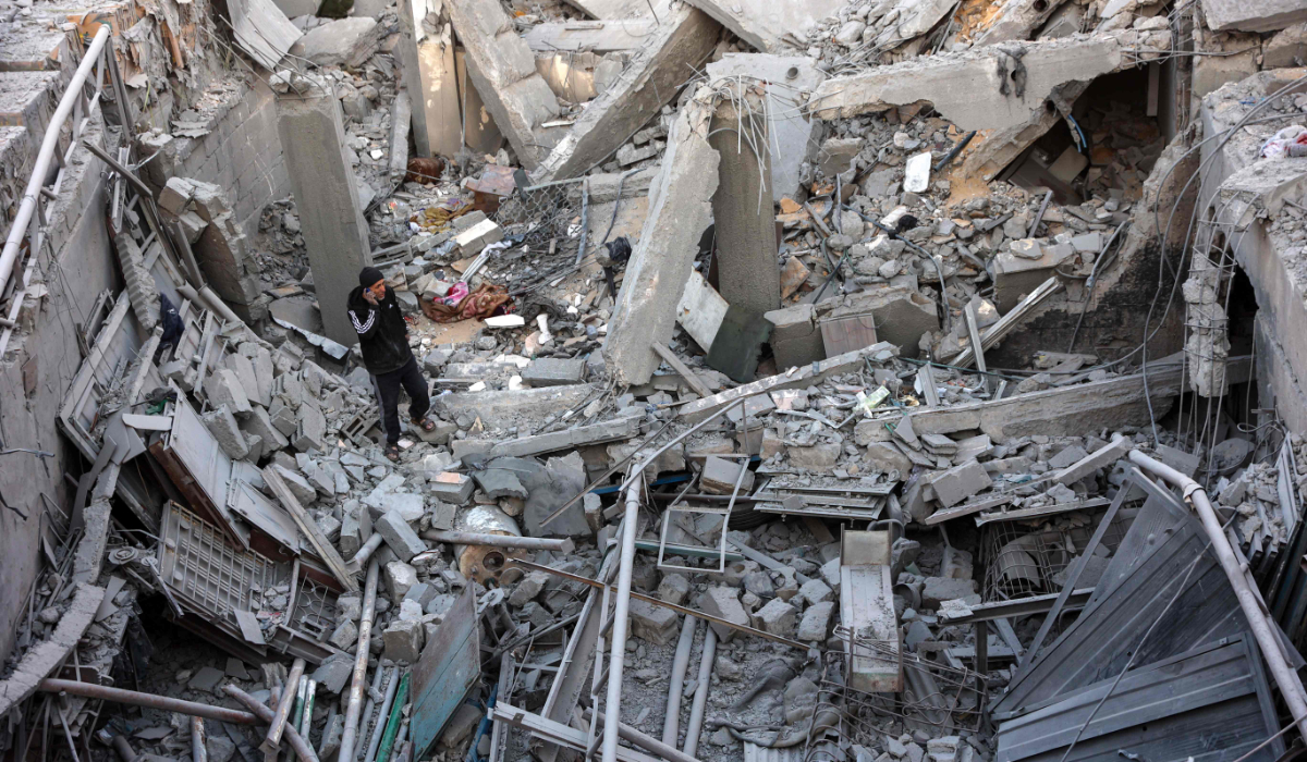 A man inspects the damage following an Israeli strike on a home belonging to the al-Zaytouniyah family, in the al-Daraj neighbourhood in Gaza City, in the central Gaza Strip on December 19, 2024, amid the continuing war between Israel and the Palestinian militant Hamas group. (AFP)