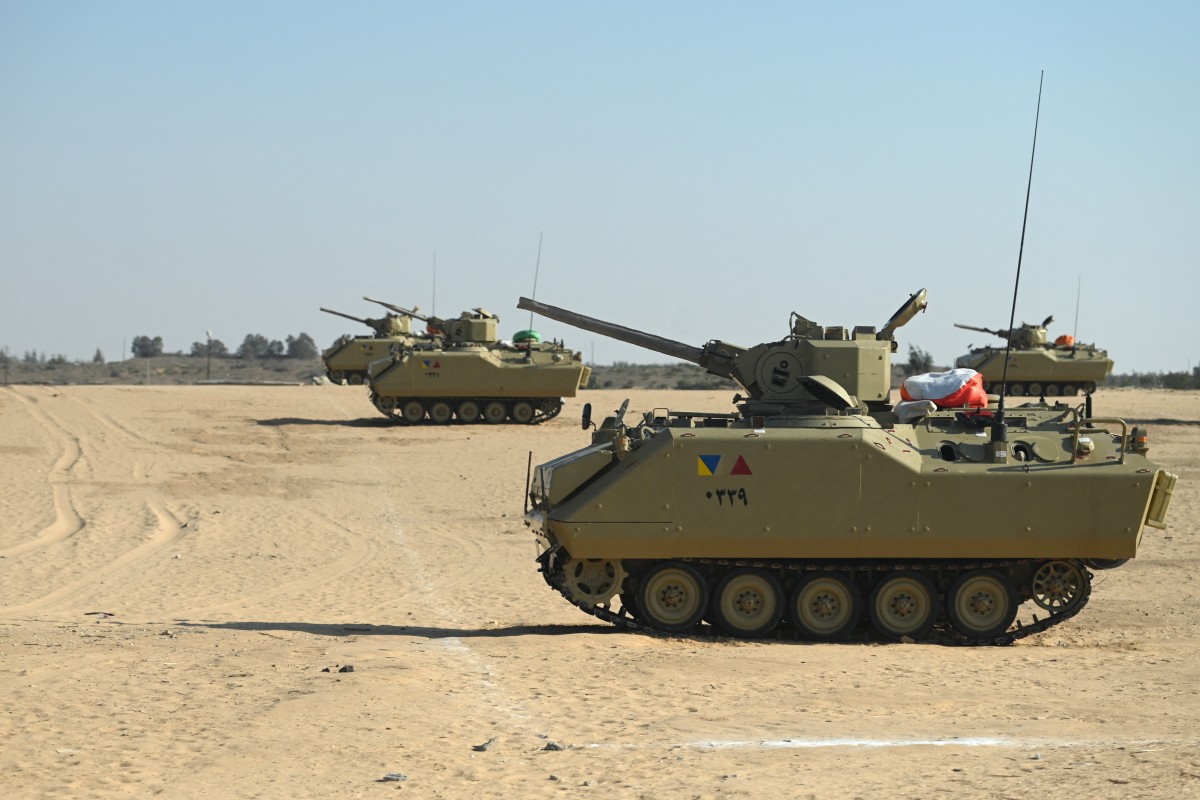 Egyptian army tanks are stationed on the Egyptian side of the Rafah border crossing with the Gaza Strip on September 9, 2024 (AFP)