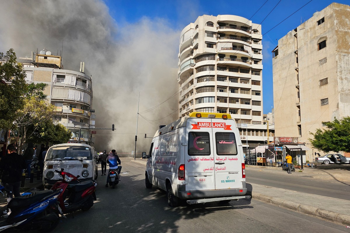 An ambulance rushed to the site of an Israeli airstrike in Beirut's southern Shiyah neighbourhood, on November 22, 2024, amid the ongoing war between Israel and Hezbollah. (Photo by AFP)