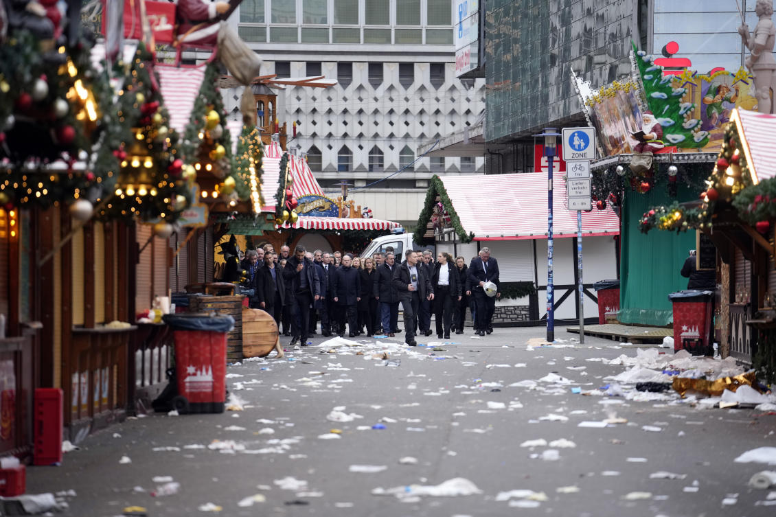 The Chancellor of Germany Olaf Scholz, center left, arrives at a Christmas Market, where a car drove into a crowd on Friday evening, in Magdeburg, Germany, Saturday, Dec. 21, 2024. (AP)