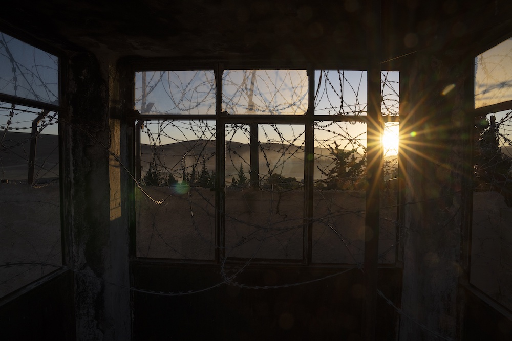 Above, barbed and razor wires hang over the windows of a guardhouse at the infamous Saydnaya military prison, on the outskirts of Damascus on Dec. 19, 2024. (AP)