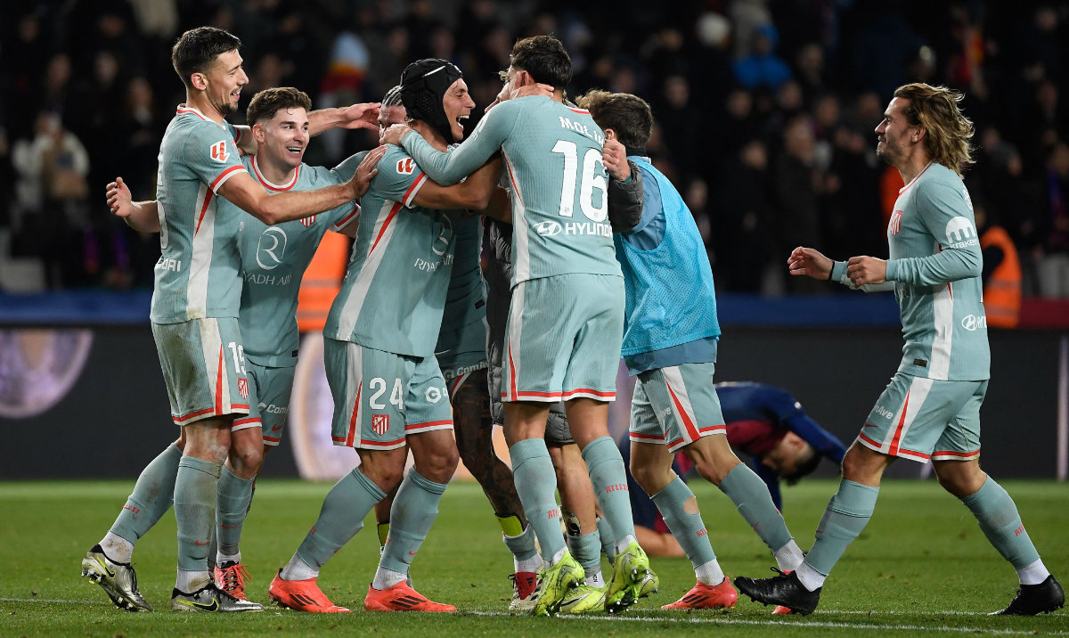 Atletico de Madrid players react at the end of the Spanish league football match between FC Barcelona and Club Atletico de Madrid at the Estadi Olimpic Lluis Companys in Barcelona on December 21, 2024. (AFP)