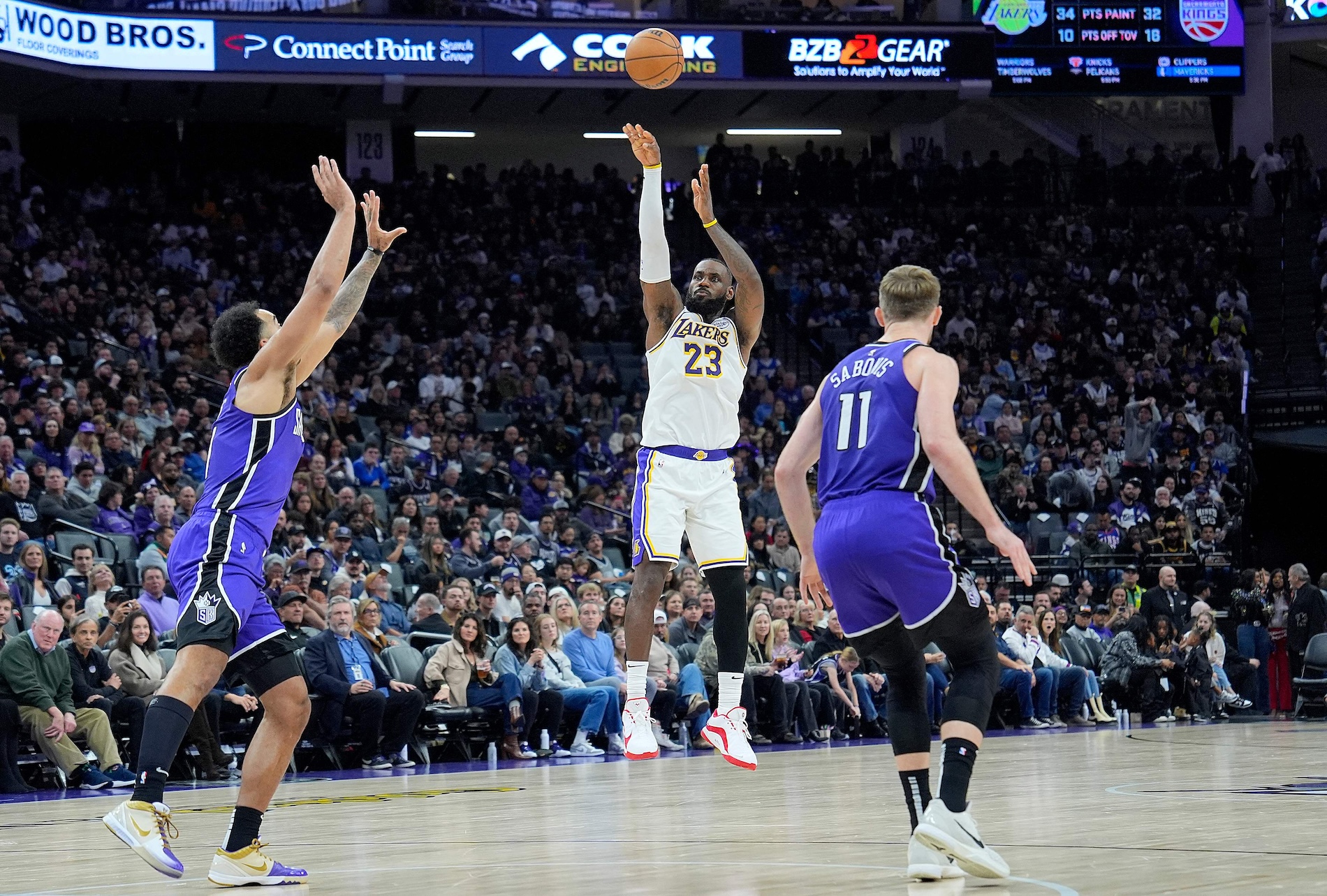 LeBron James of the Los Angeles Lakers shoots a three-point shot against the Sacramento Kings during the second half of an NBA game at Golden 1 Center on Dec. 21, 2024 in Sacramento, California. (AFP)