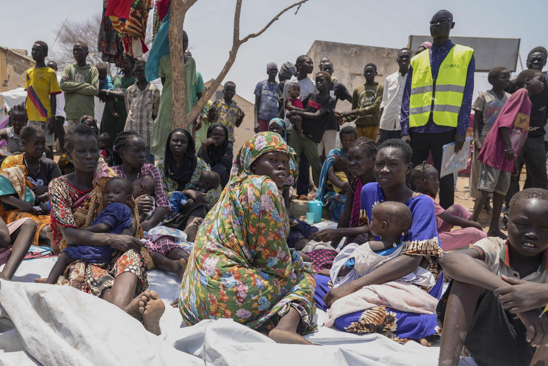 South Sudanese people sit outside a nutrition clinic at a transit center in Renk, South Sudan, on May 16, 2023. (AP)