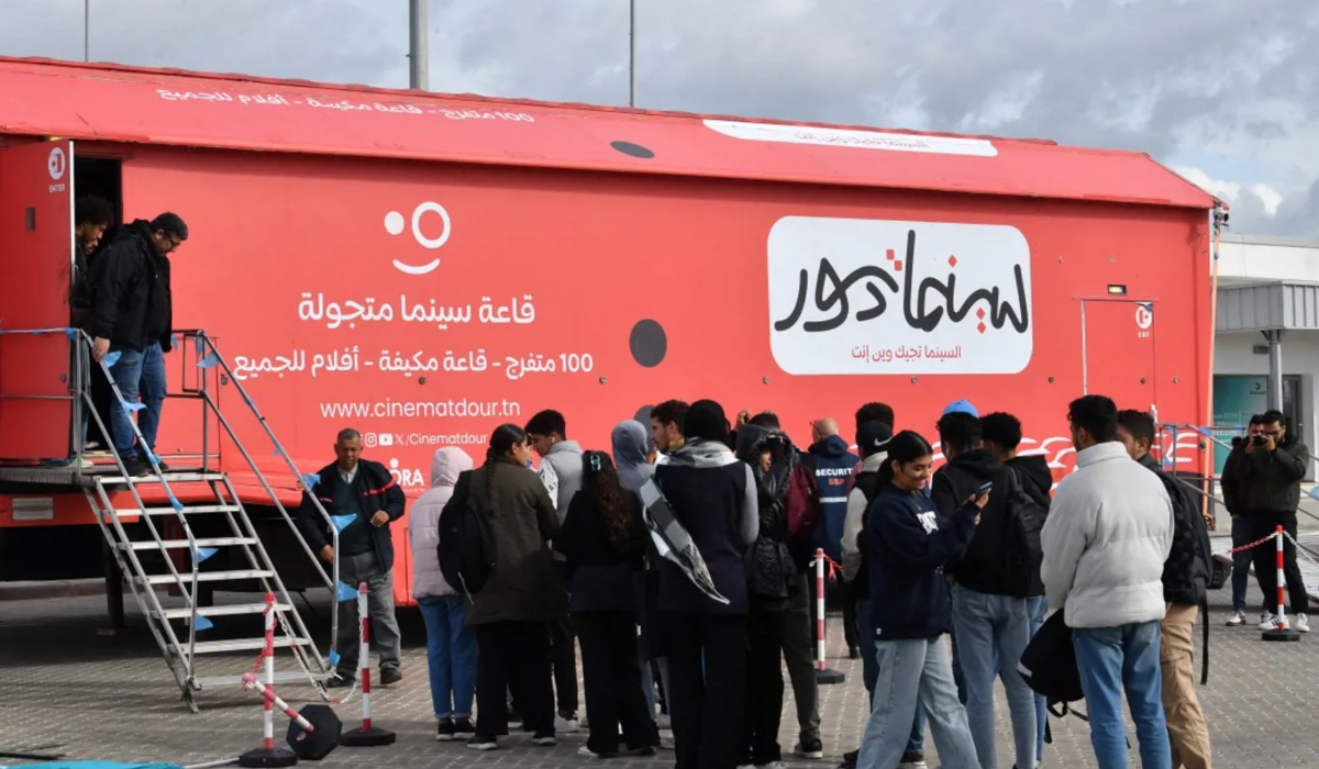 The bright red truck has transformed parking lots into pop-up theaters. (AFP)