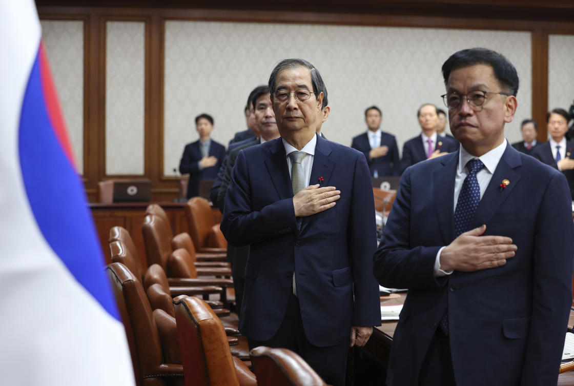 South Korea’s Prime Minister Han Duck-soo, second from right, who became the country’s acting leader after President Yoon Suk Yeol’s impeachment, salutes during a cabinet meeting at the government complex in Seoul, South Korea, Tuesday, Dec. 24, 2024. (AP)