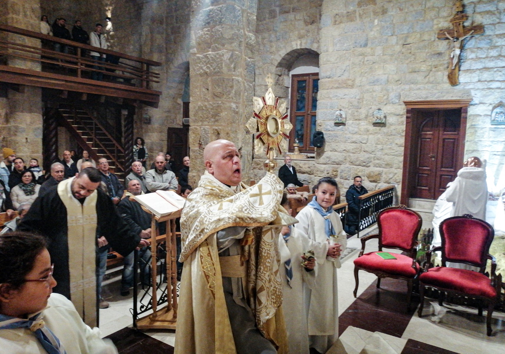 A priest leads mass at a church in the village of Qlayaa, on the southern border with Israel, on December 21, 2023. (File/AFP)