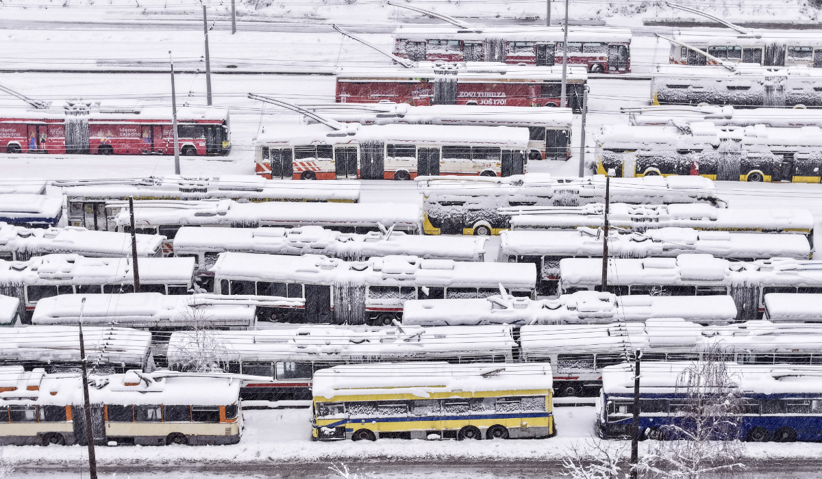 An aerial view of parked trolley buses during heavy snowfall in Sarajevo, Bosnia, Tuesday. The snow is heaviest in the western parts of the country. (AP)