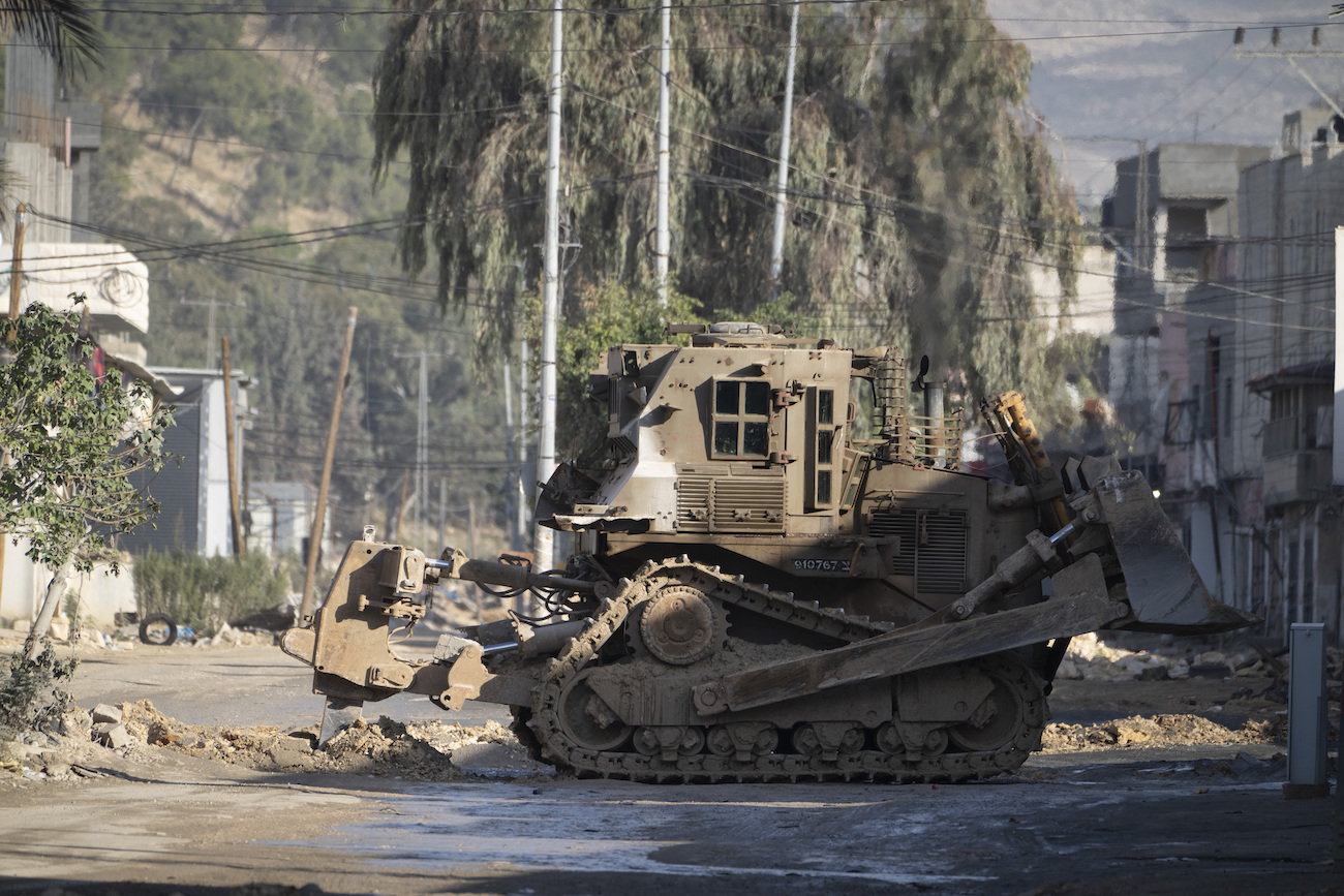 Israeli military bulldozers are seen during a military raid in the Nur Shams refugee camp near the West Bank city of Tulkarem, Tuesday, Dec. 24, 2024. (AP)