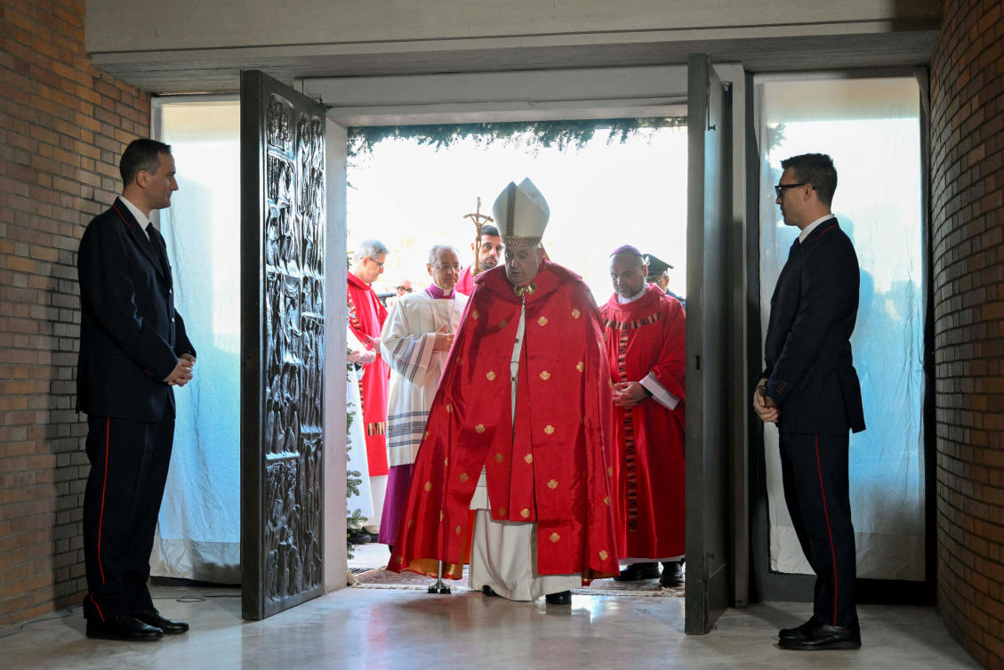 Pope Francis opens a Holy Door, one of only five that will be open during the 2025 Catholic Holy Year, at Rebibbia prison in on Dec. 26, 2024. (Vatican Media via Reuters)