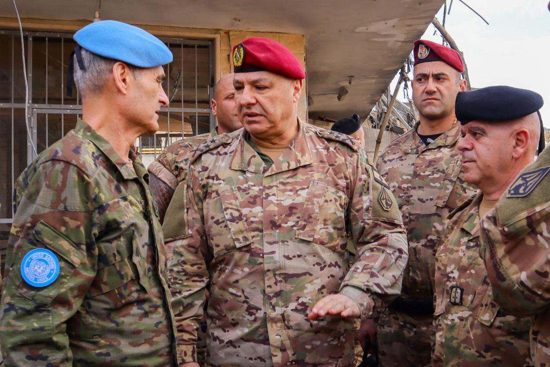 Lebanese army commander, General Joseph Aoun (C), speaks with Major General Aroldo Lazaro, Head of Mission and Force Commander of the United Nations Interim Force in Lebanon (UNIFIL) (L) during a visit to the southern Lebanese village of Khiam on December 23, 2024, after the withdrawal of Israeli forces from the area under a ceasefire deal with Hezbollah. (AFP)