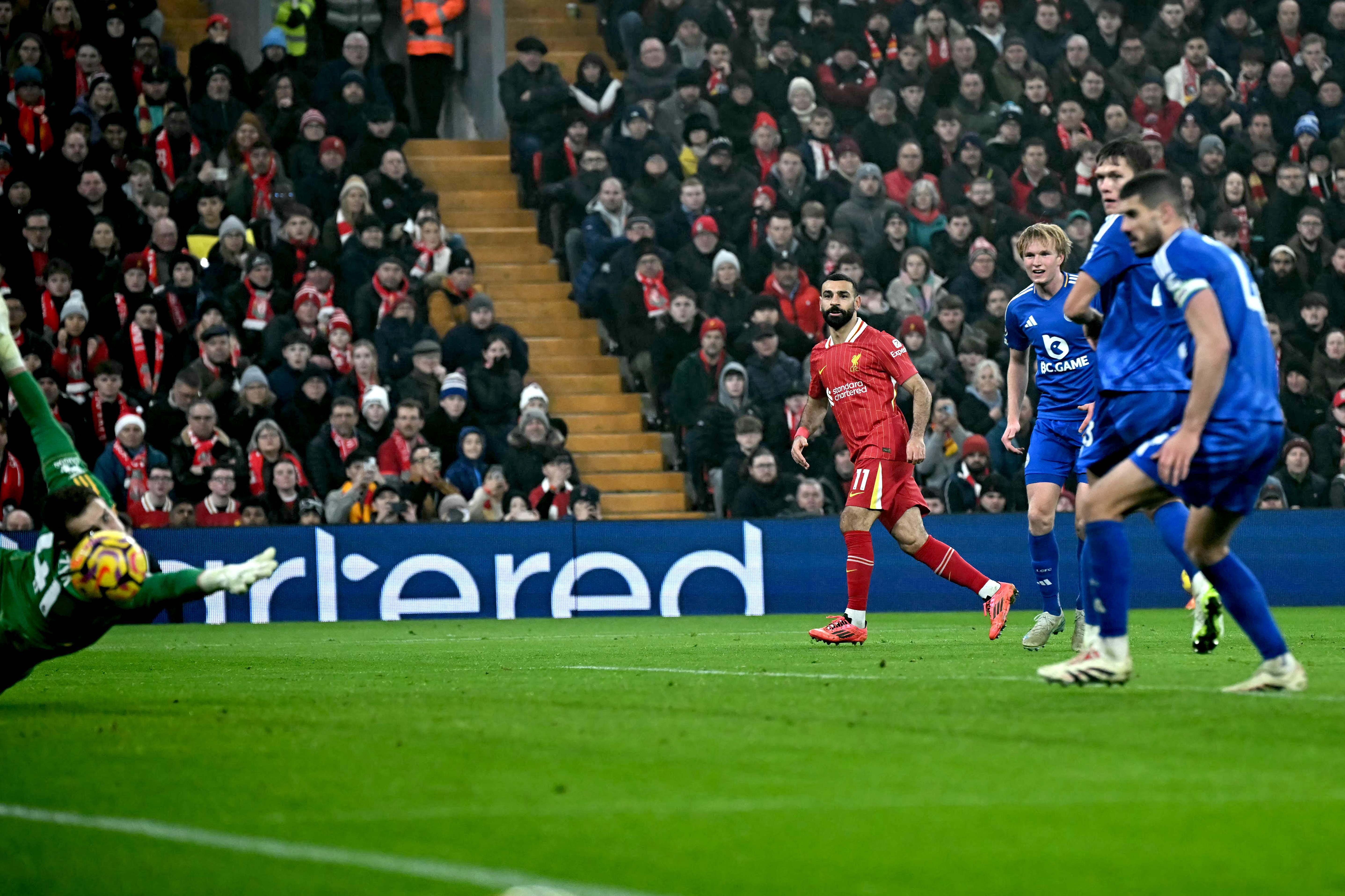 Liverpool’s Egyptian striker Mohamed Salah scores the team’s third goal during the English Premier League football match between Liverpool and Leicester City at Anfield in Liverpool, north west England, on Dec. 26, 2024. (AFP)